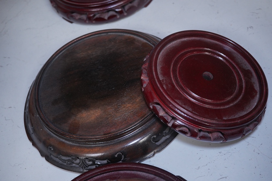 Eight assorted Chinese hardwood vase stands. Condition - fair to good